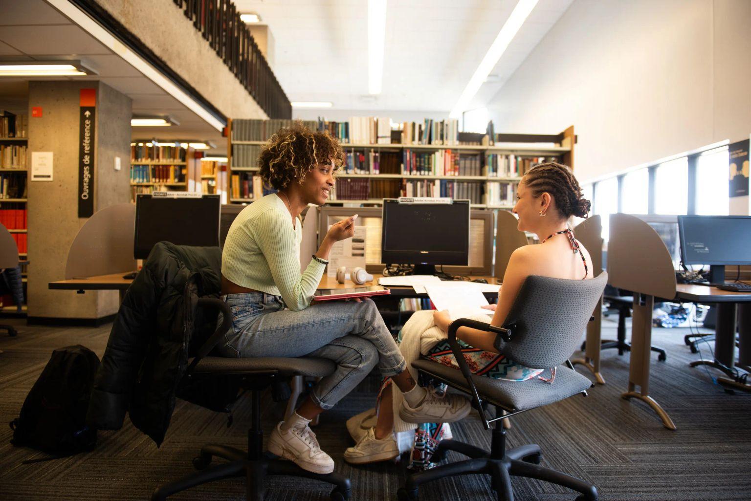 Students collaborating around a table in a campus study area